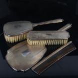 An Elizabeth II silver 4-piece dressing table set, comprising hand mirror, hair brush, clothes brush