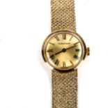 JAEGER LE COULTRE - a lady's 9ct gold mechanical bracelet watch, champagne dial with Roman numeral