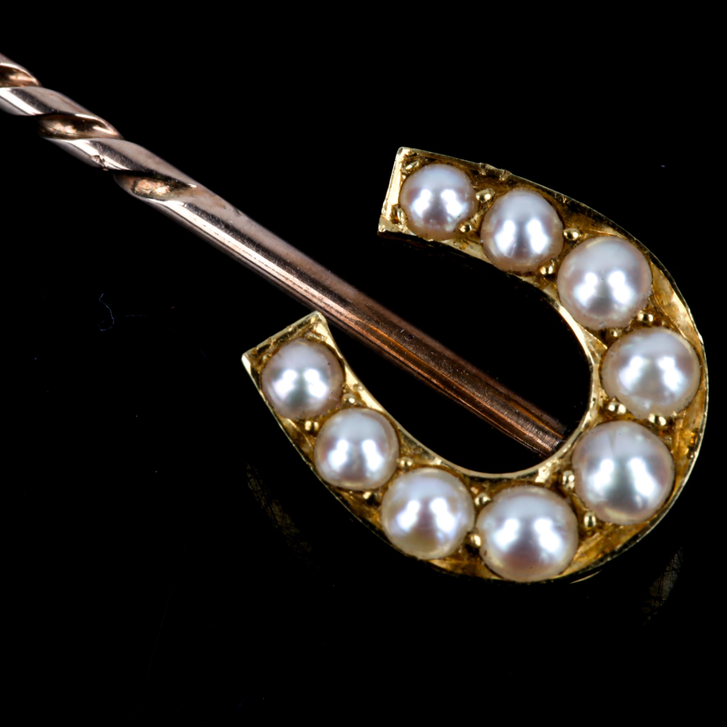 A Victorian pearl horseshoe stickpin, unmarked gold settings, overall length 69.3mm, 3.9g No