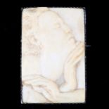 An Art Nouveau Austrian unmarked silver and ivory panel brooch, relief carved panel depicting