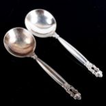 GEORG JENSEN - a pair of Danish sterling silver Acorn/Konge pattern preserve spoons, length 13cm,