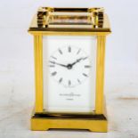 A modern Mappin & Webb brass-cased carriage clock, white dial with Roman numeral hour markers and
