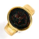 A heavy Victorian 18ct gold bloodstone seal signet ring, lion head crest with motto 'Heb dduw heb