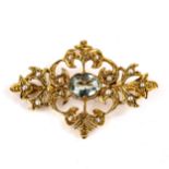 A late 20th century 9ct gold blue topaz and split-pearl brooch, openwork floral design with oval