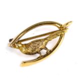 An Edwardian 9ct gold hunting brooch, depicting pheasant and wishbone, maker's marks H and N,