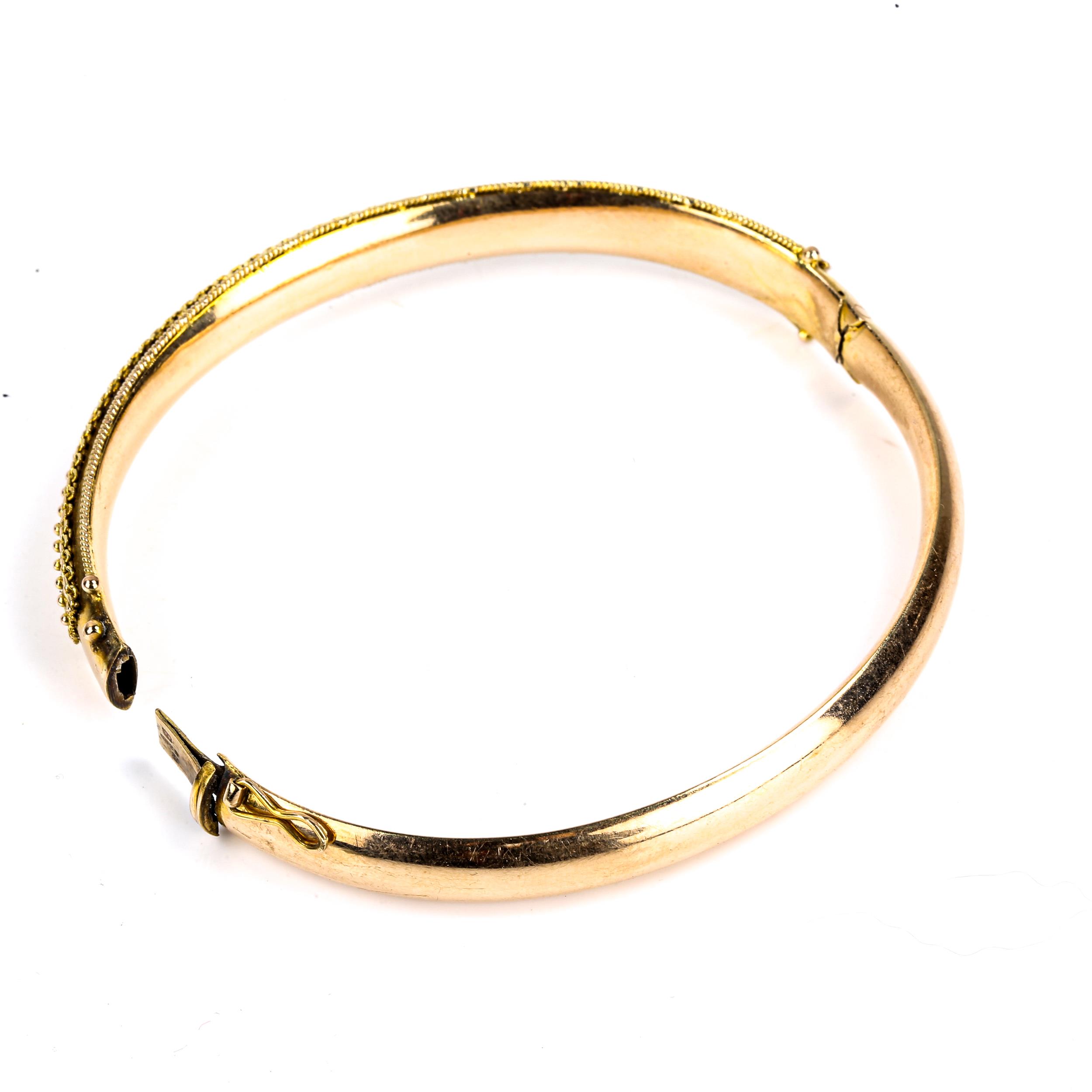 A late 20th century 9ct gold Etruscan style hinged bangle, cannetille and rope twist decoration, - Image 3 of 4