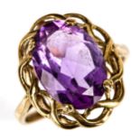 A modern 9ct gold amethyst dress ring, openwork settings with oval mixed-cut amethyst, setting