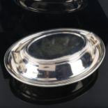 An Elizabeth II silver entree dish and cover, oval form with two handles, by Roberts & Belk,