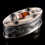 An Edwardian silver gem set dressing table box, oval form with relief embossed floral swag