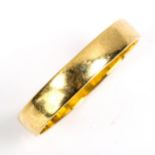 A large 18ct gold wedding band ring, hallmarks Birmingham 1968, band width 4.2mm, size X, 3.8g No