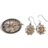 A Victorian unmarked silver and gold demi-parure, comprising brooch and pair of earrings, pierced