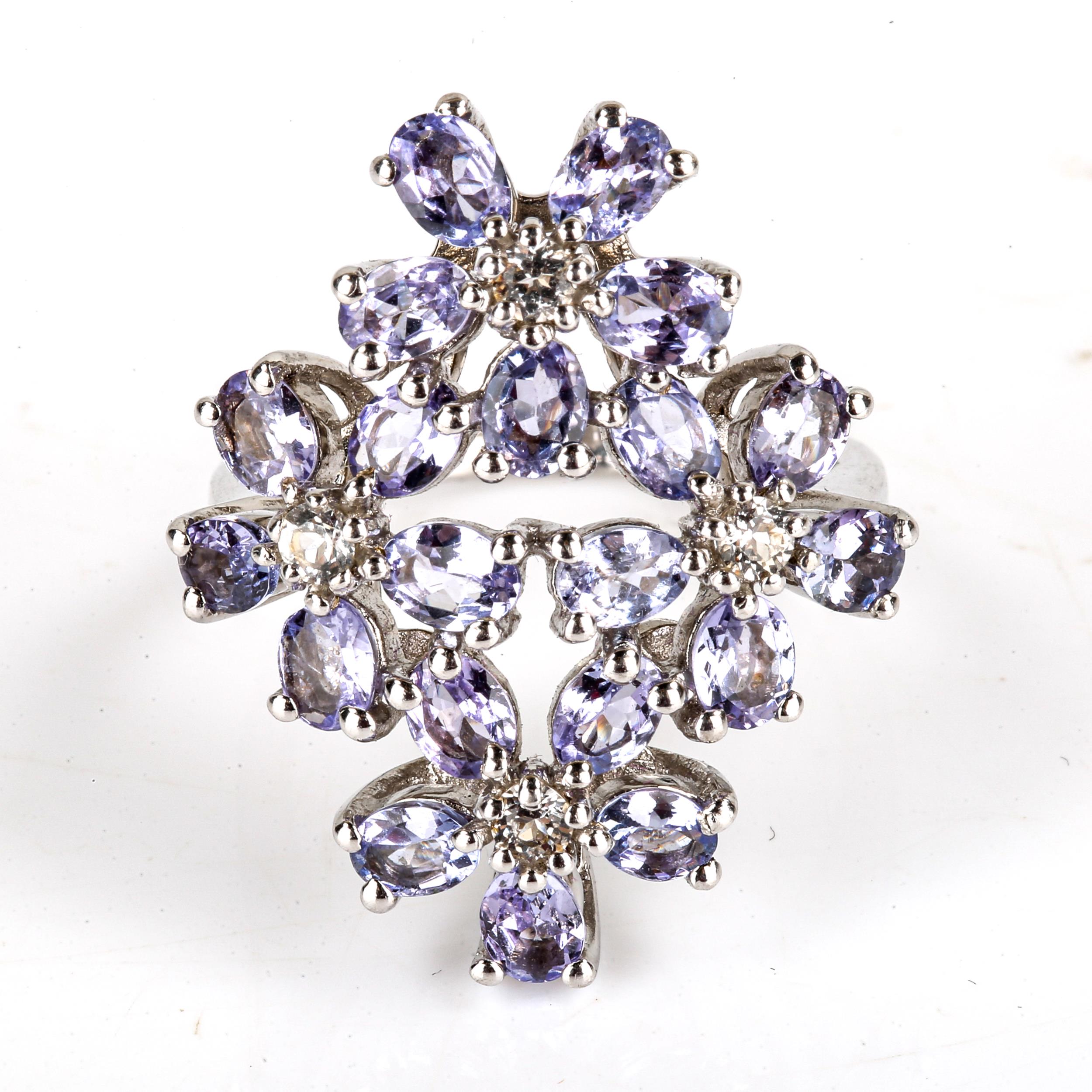 A large modern sterling silver tanzanite and cubic zirconia flowerhead ring, set with oval-cut - Image 2 of 4