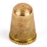 An unmarked gold thimble, height 23.2mm, opening diameter 15.1mm, 4g No damage or repair, inside