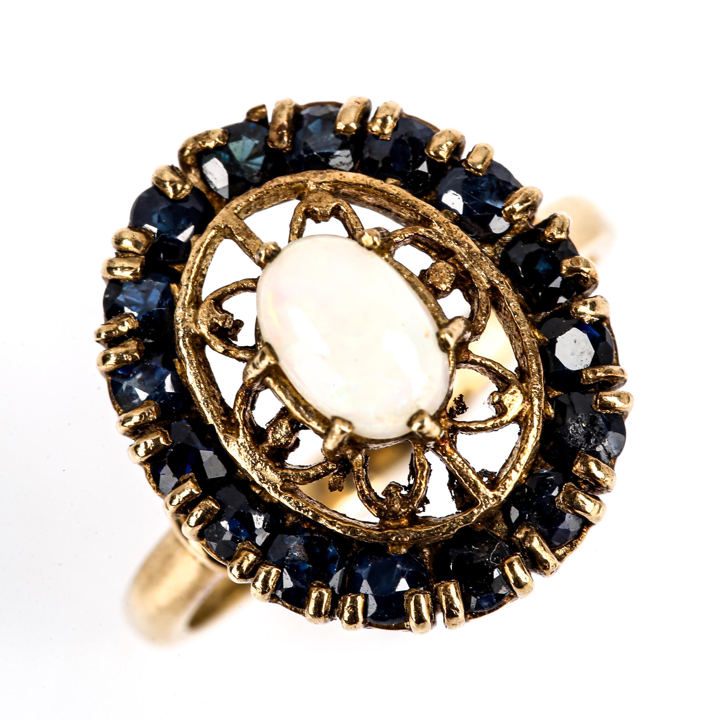 A late 20th century 9ct gold opal and sapphire oval cluster ring, set with oval cabochon opal and