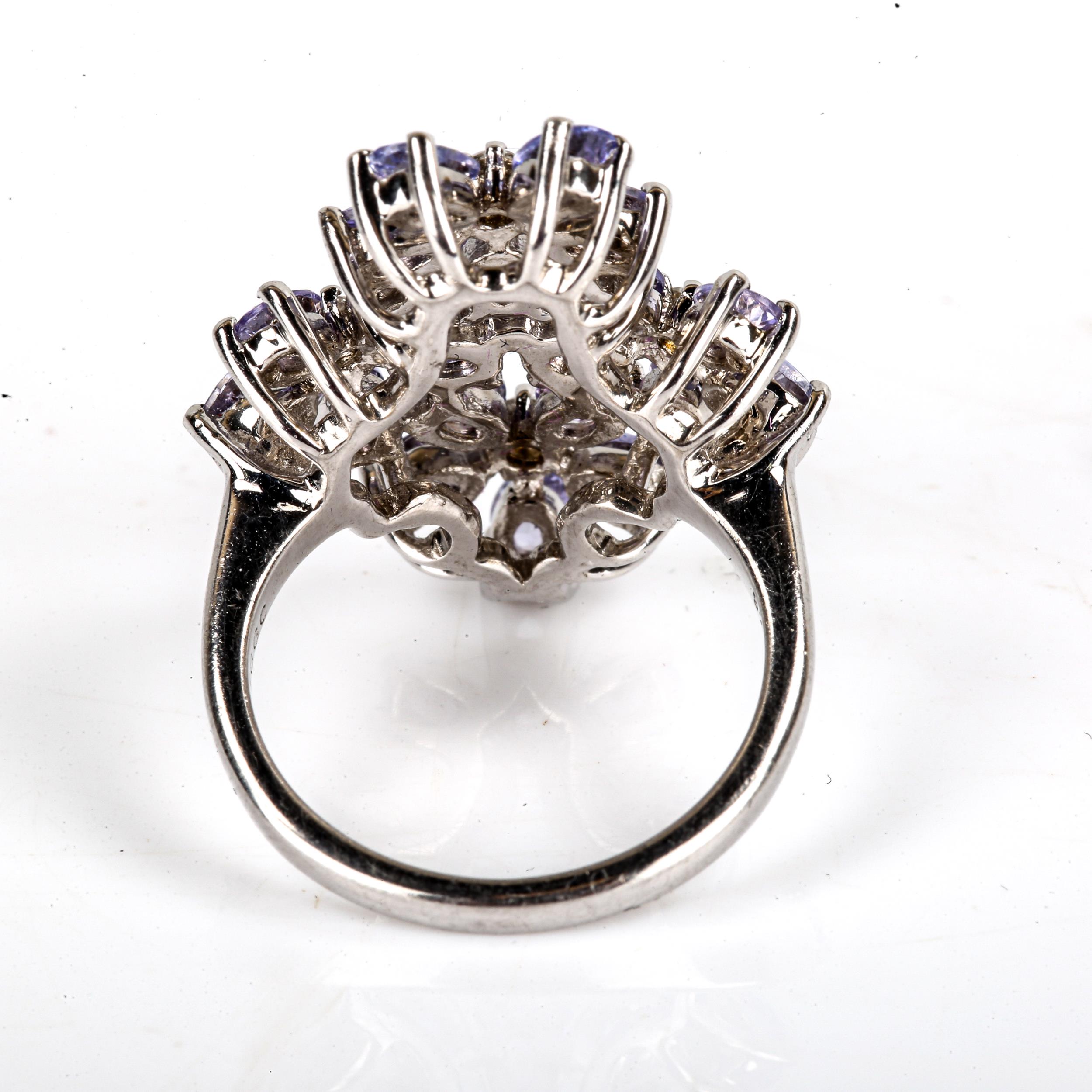 A large modern sterling silver tanzanite and cubic zirconia flowerhead ring, set with oval-cut - Image 3 of 4