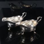 HARRODS - a pair of Elizabeth II silver sauce boats, with gadrooned rim and scrolled acanthus