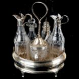 A George III silver five bottle cruet stand, with silver mounted glass condiment bottles, mustard