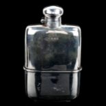 A George V silver curved hip flask, with bayonet hinged cap and removeable beaker cup with gilt