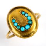 A Victorian unmarked gold and turquoise horseshoe bombe panel ring, setting height 16.9mm, size O,