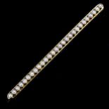 An Edwardian 15ct gold pearl line bar brooch, brooch length 64.7mm, 4.6g No damage or repairs, all