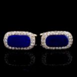 A pair of 18ct gold lapis lazuli and diamond cluster cufflinks, panel length 19.4mm, 11.7g Some glue