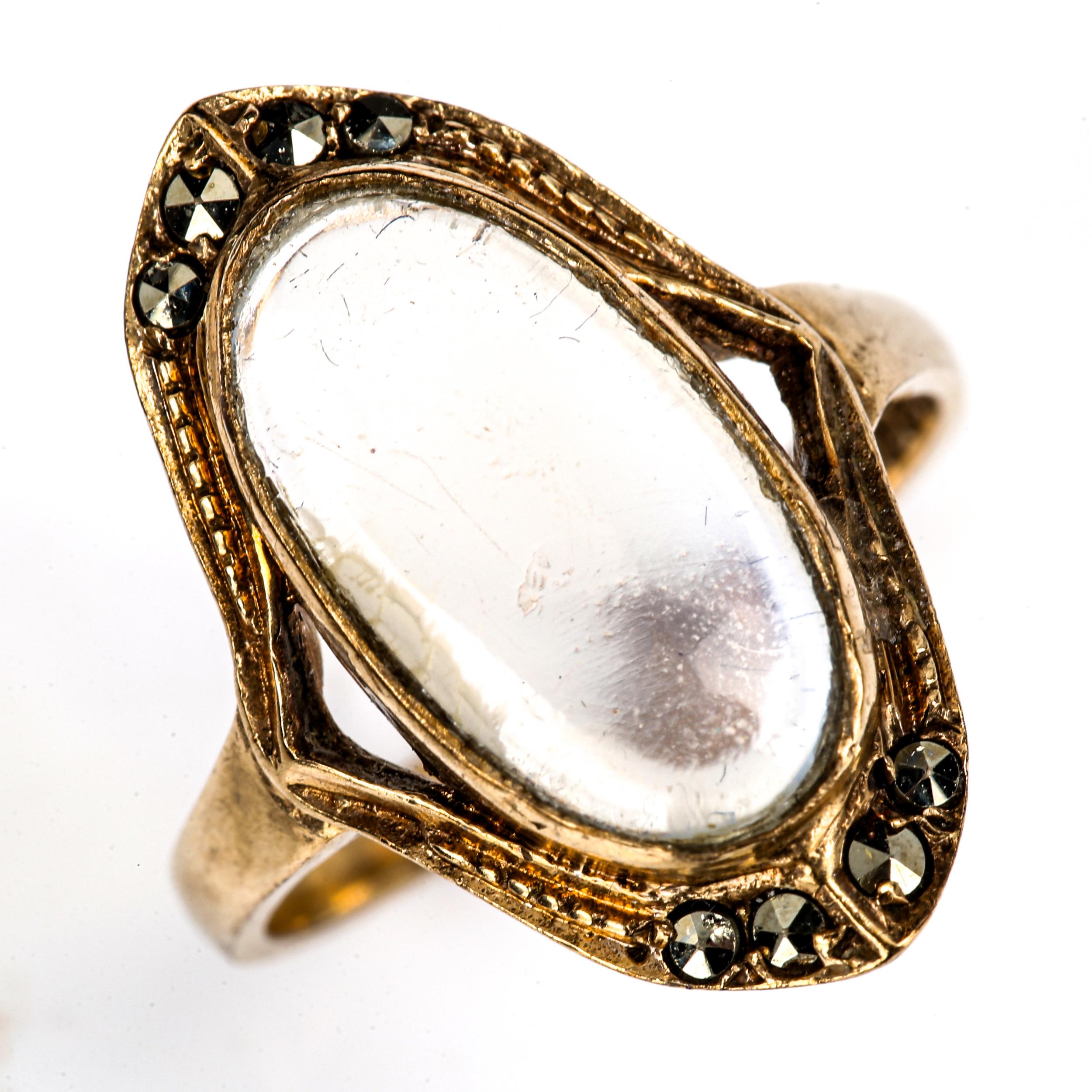 A Continental 9ct gold blue moonstone and marcasite dress ring, set with oval cabochon moonstone,