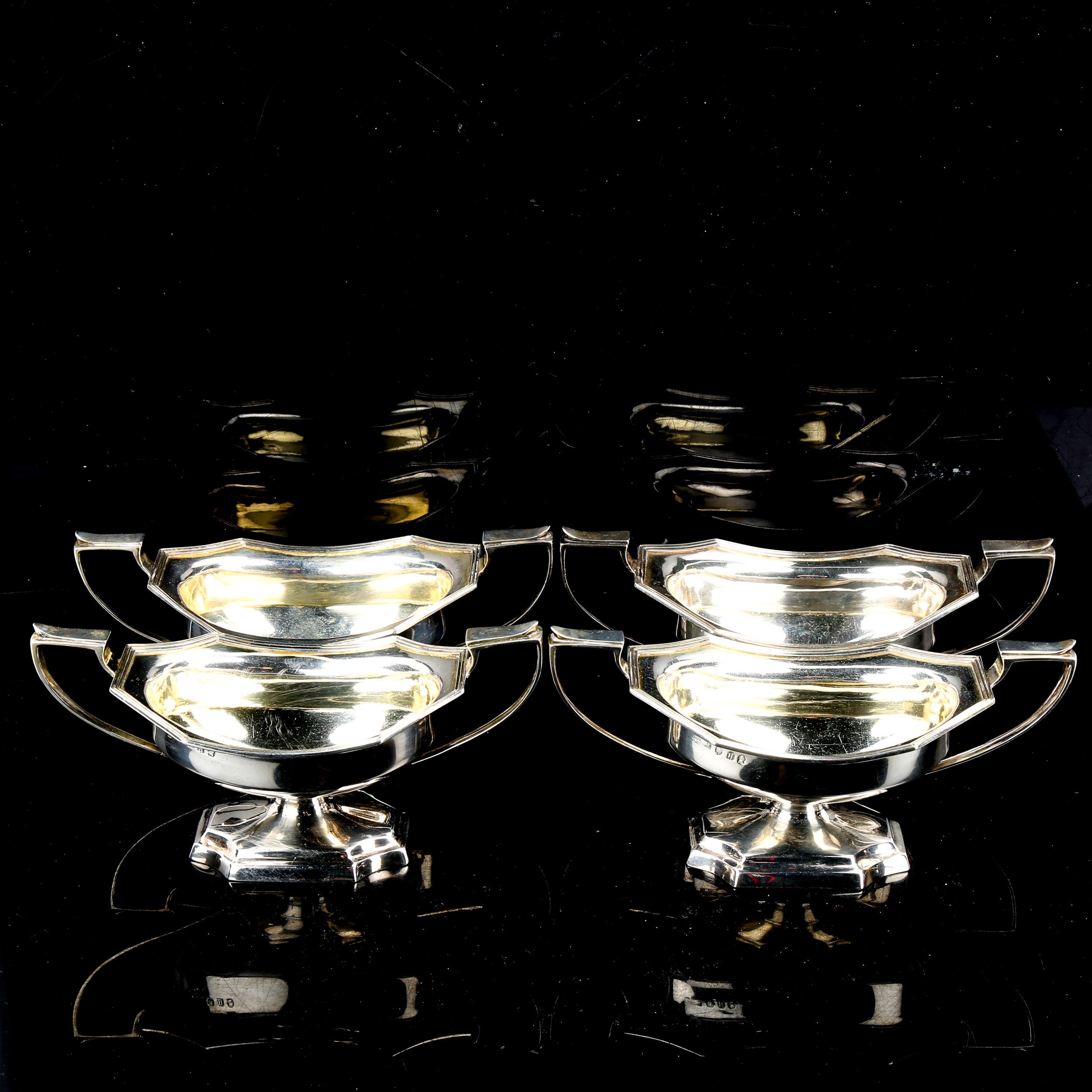 A set of 4 George III silver two-handled salt cellars, octagonal form with pedestal bases, reeded