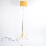 A mid-century tripod floor lamp, gilt stem on ball feet, adjustable height fully extended 170cm