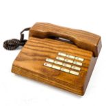 GFELLER TRUB, A 1970s'/80s' solid elm telephone. Good condition, working order