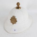 A Gibraltar military pith helmet, with cap badge, size 60