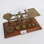 A set of Mordan & Co brass post balance scales and weights, base length 27cm