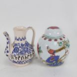 An Armenian ewer 'The Young Turkish Revolution 1908' and a Chinese ginger jar and cover, with bird