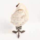 A cameo carved conch shell decorated with Classical scenes, on a patinated bronze gurgle fish design