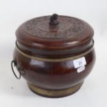 A Chinese elm pot and cover, with relief carved lid and metal bands, height to lid 19cm, diameter