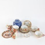 A Chinese blue and white Prunus pattern ginger jar and cover, hand painted and gilded teacups and