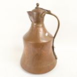 A large Middle Eastern copper and brass water flagon, height 43cm