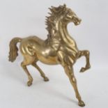 A large cast-brass fireside horse figure, height 42cm