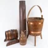 A copper-bound ice bucket on tripod support, height 40cm, a similar barrel on stand and jug, and a