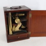 An Antique mahogany-cased brass microscope, by L H Steward, Cornhill London, no. 680, case height