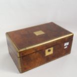 A Victorian brass-bound figured walnut travelling writing slope, with fitted interior and original