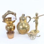 A brass Guernsey milk jug, 18cm, a brass figure, nesting pair of 19th century apothecary's
