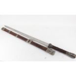 A reproduction Eastern sword and hardwood scabbard, blade length 71cm