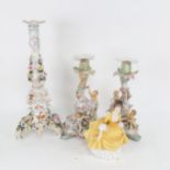 A Continental porcelain candlestick with applied flowers, 36cm, a pair of smaller candlesticks