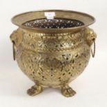 19th century Dutch brass jardiniere, relief embossed and pierced surround, with lion ring handles