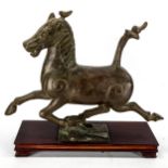 A Chinese patinated bronze sculpture of a running horse on wood plinth base, length 35cm