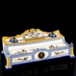 A French Gien faience pottery desk stand with integral inkwells and covers, length 29cm Very good