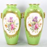A pair of Cauldon green ground porcelain vases with hand painted botanical panels, signed B