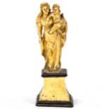 An Antique carved ivory figure of Mary with the Infant Christ, 18th or 19th century, on ivory plinth