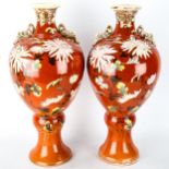 A pair of Japanese Satsuma pottery vases, circa 1900, with painted floral designs, height 40cm