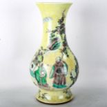 A Chinese yellow glaze porcelain vase, with painted figures and trees, 6 character mark, height 32cm